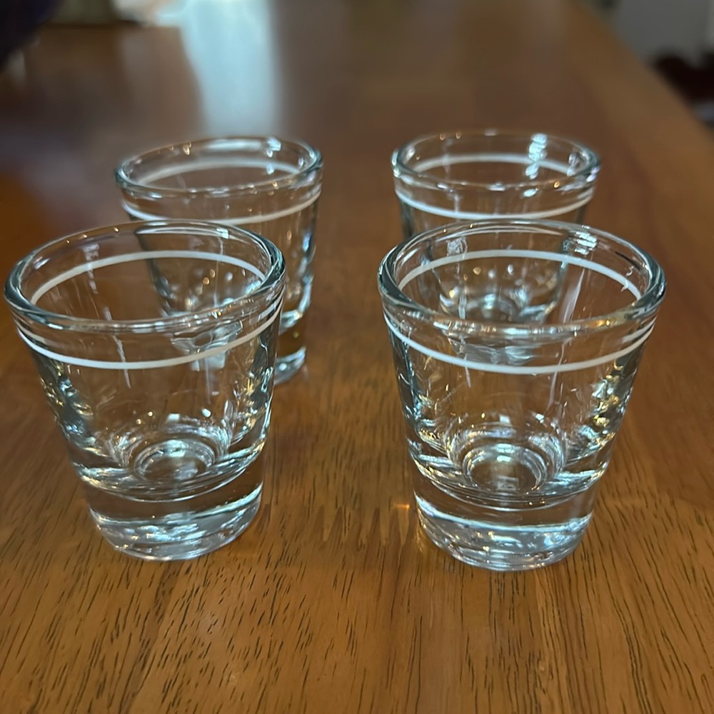 Anchor Hocking shot glasses. Clear with white stripe. Originally from Starbucks